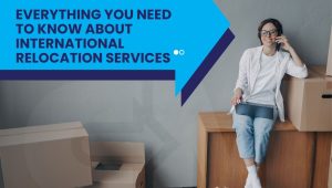 Woman sitting beside moving boxes representing an international relocation company